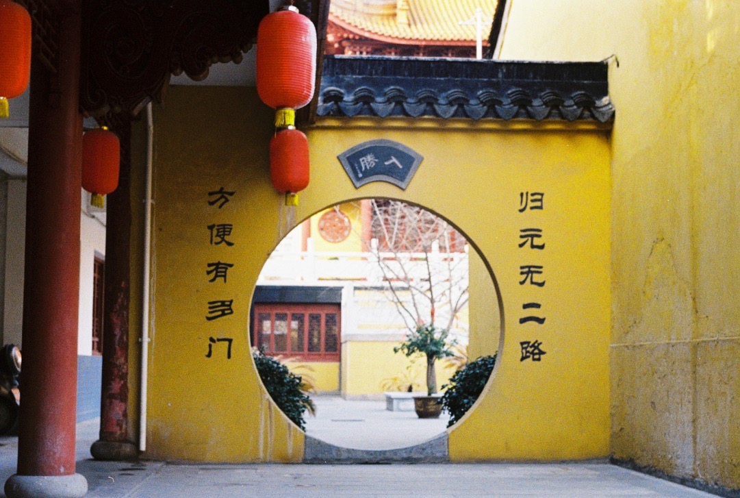 round gate in a yellow wall