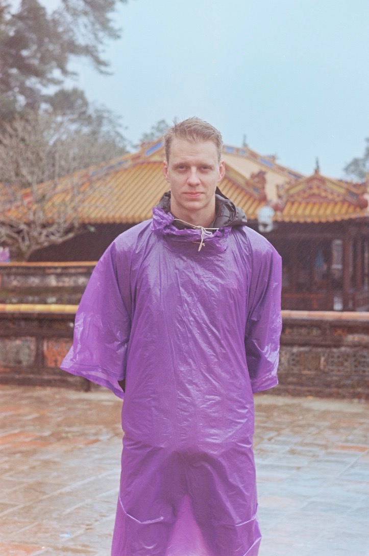 Samu wearing a purple raincoat