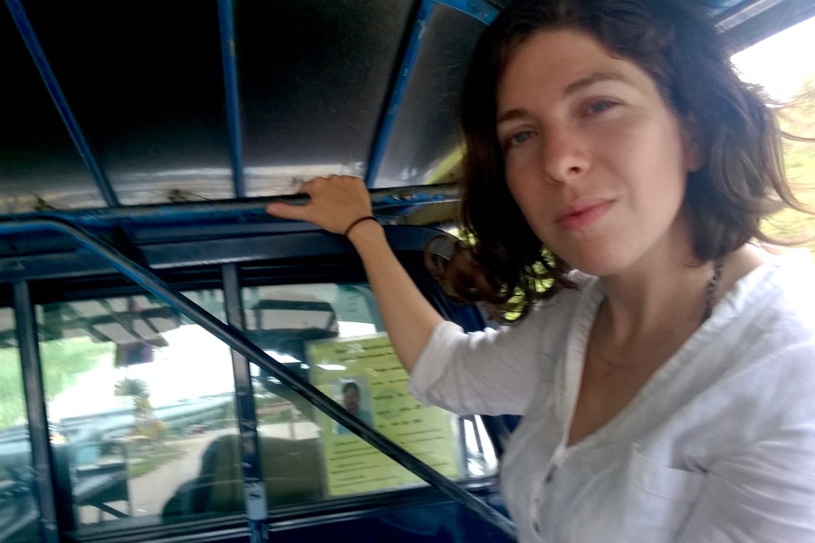 Eszter sitting in a pickup taxi