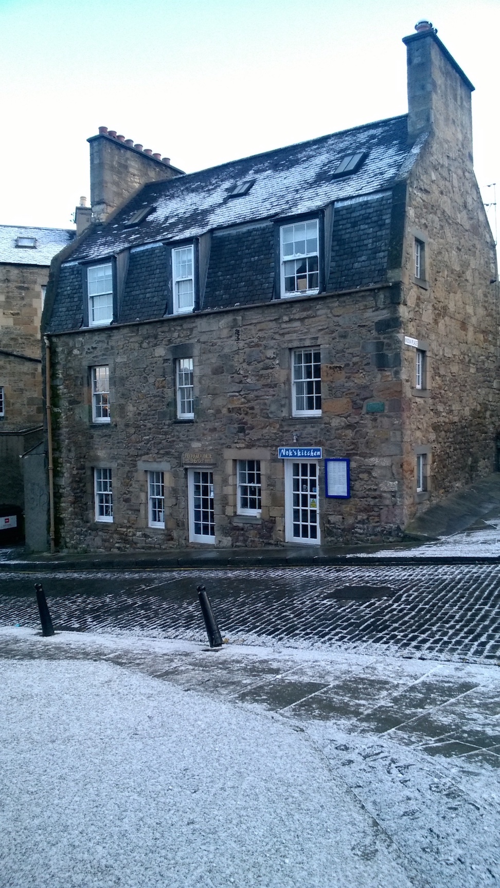 Cobblestone street in Edinburgh, with some snow cover