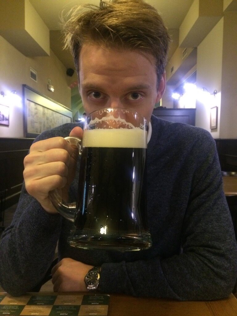 Samu with a litre sized dark beer